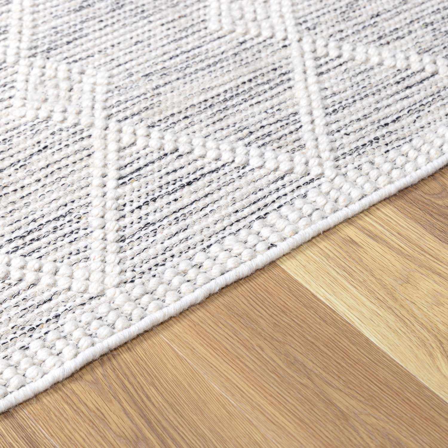 Detailed look at the pile on Whittington Wool Area Rug, showcasing its softness and plushness. Transitional,Bohemian Area Rug Backing  