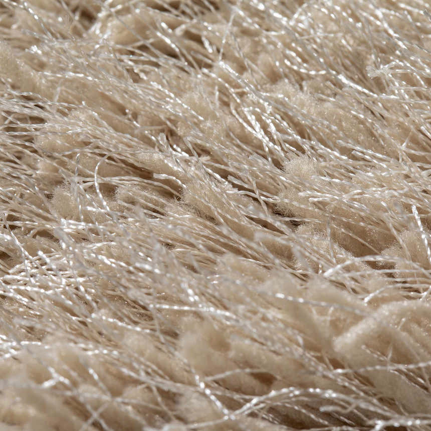 Close-up of the plush Dalyn Impact IA100 Sand Area Rug, showing soft, high-pile shag texture and sandstone color.