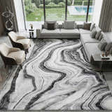 Living room with gray sectional and Itotia Marble Green Area Rug featuring a swirling marble design. Roomscene-Rectangle