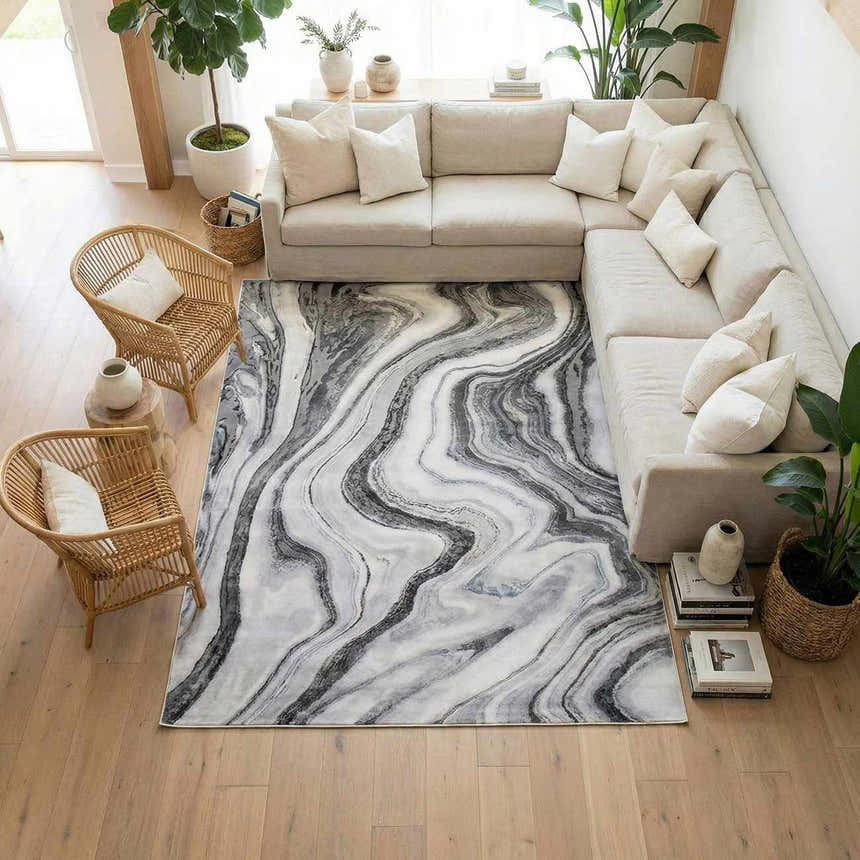 Living room scene with a neutral sofa and the Itotia Marble Green Area Rug featuring a swirling marble pattern. Roomscene-Rectangle