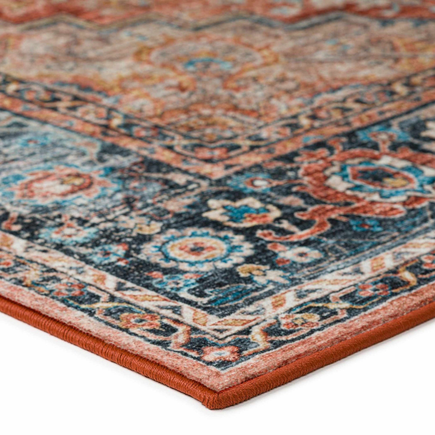 Close-up of Dalyn Jericho JC2 Spice Area Rug. Traditional floral pattern in light brown, paprika, spice, taupe, and teal.