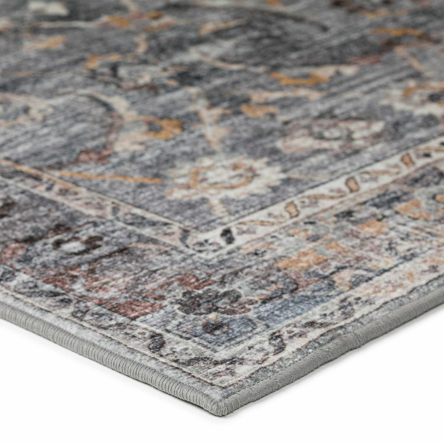 Close-up of the Dalyn Indoor/Outdoor Jericho JC4 Silver Area Rug. Features chestnut, gold, and silver gray tones in a traditional pattern.