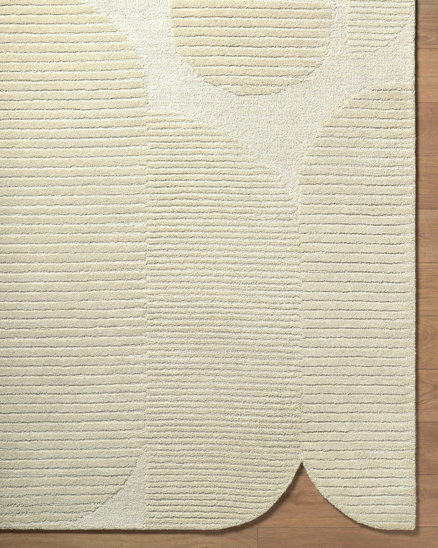 Close up of the Ecru Abstract Modern Hand Tufted Wool Area Rug showing the texture and geometric pattern. Corner