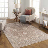 Living room scene with a Kaongkod Area Rug in dusty pink, ivory, and brown, styled with a chair, side table, and console table. Roomscene-Rectangle