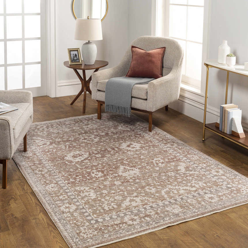 Living room scene with a Kaongkod Area Rug in dusty pink, ivory, and brown, styled with a chair, side table, and console table. Roomscene-Rectangle