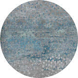 Close-up of round Dalyn Luxury Kochi KC13 Gray Area Rug. Features denim, navy, and silver gray abstract pattern.