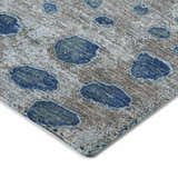 Close-up of the Dalyn Luxury Kochi KC13 Gray Area Rug. Features a gray background with denim and navy abstract spots.