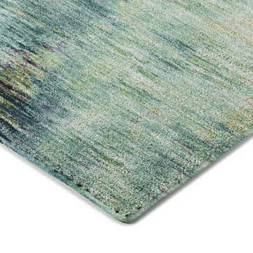 Close-up of the teal Dalyn Luxury Kochi KC1 rug, showing its textured weave and subtle beige, green, and navy accents.