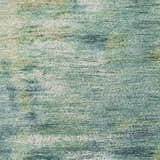 Close-up of the Dalyn Luxury Kochi KC1 Teal Area Rug, showing its texture and beige, green, and teal colors.