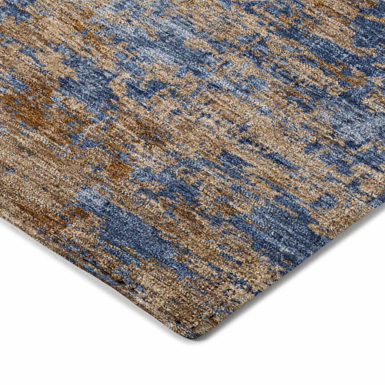 Close-up of the Dalyn Luxury Kochi KC2 Navy Area Rug, showing beige, brown, and denim blue textured pattern.