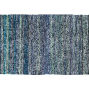 Close-up of the Dalyn Luxury Indoor/Outdoor Kochi KC5 Blue Area Rug featuring denim, green, and teal vertical stripes.