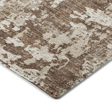 Close-up of the Dalyn Luxury Indoor/Outdoor Kochi KC7 Brown Area Rug showing its beige, ivory, and brown abstract pattern.
