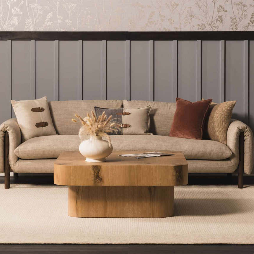 Living room scene with a Kayoko Ivory Area Rug, a tan sofa, wood coffee table, and neutral decor. Roomscene-Rectangle