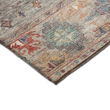 Close-up of the Dalyn Karaj KJ5 Gray Washable Area Rug, showing its beige, brown, paprika, and light blue traditional pattern.