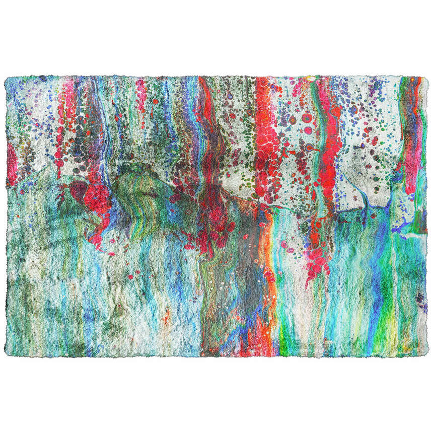 Close-up of the Dalyn Machine Kikiamo KK2 Confetti Washable Area Rug with bright pink, teal, and purple hues. Contemporary style.