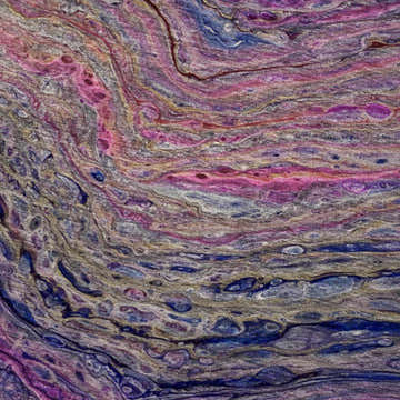 Close-up of Dalyn Machine Kikiamo KK3 Passion Washable Area Rug with chestnut, navy, passion, pink, purple, and taupe colors.