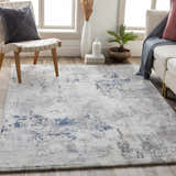 Living room scene with Livabliss Aisha Surya AIS-2314 area rug in blue, charcoal, light gray, and off-white colors. Roomscene-Rectangle