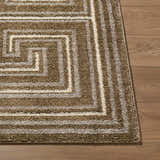 Close-up of the Kekapa Area Rug. Farmhouse style rug with brown and ivory geometric pattern and textured weave. Front
