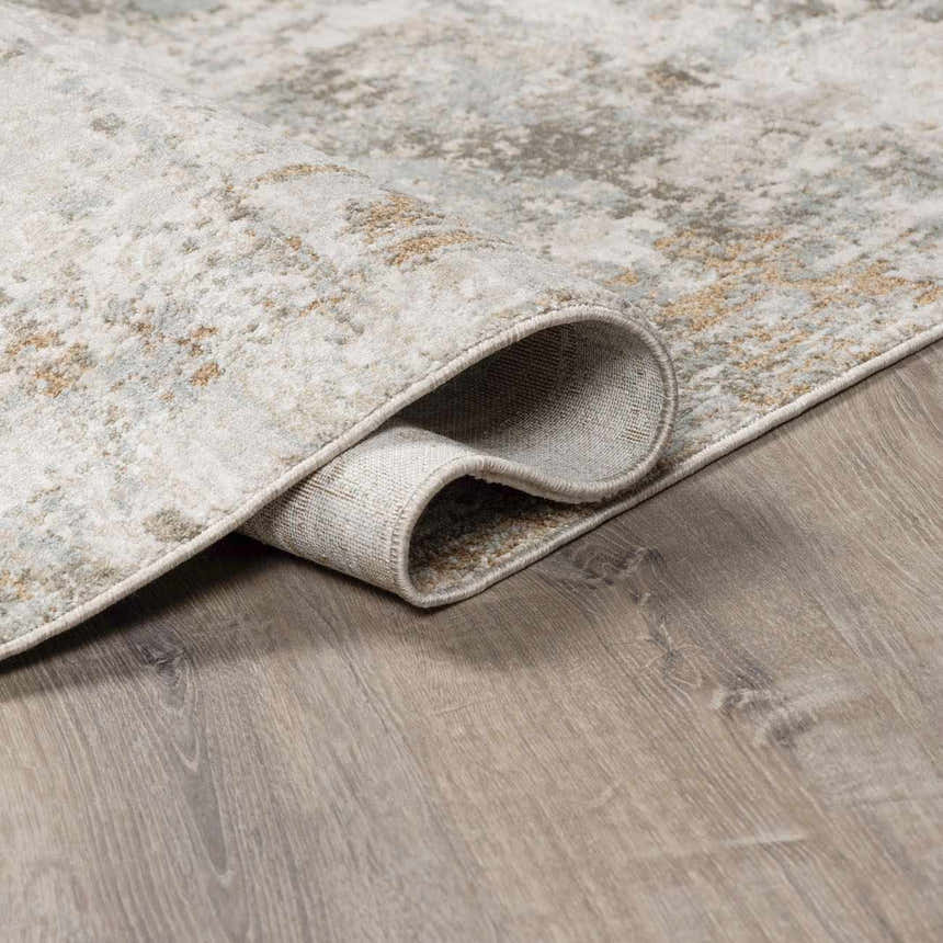 Close-up of the Kress Thick Luxe Abstract Rug, showing its charcoal, sage, and light gray contemporary design. Fold