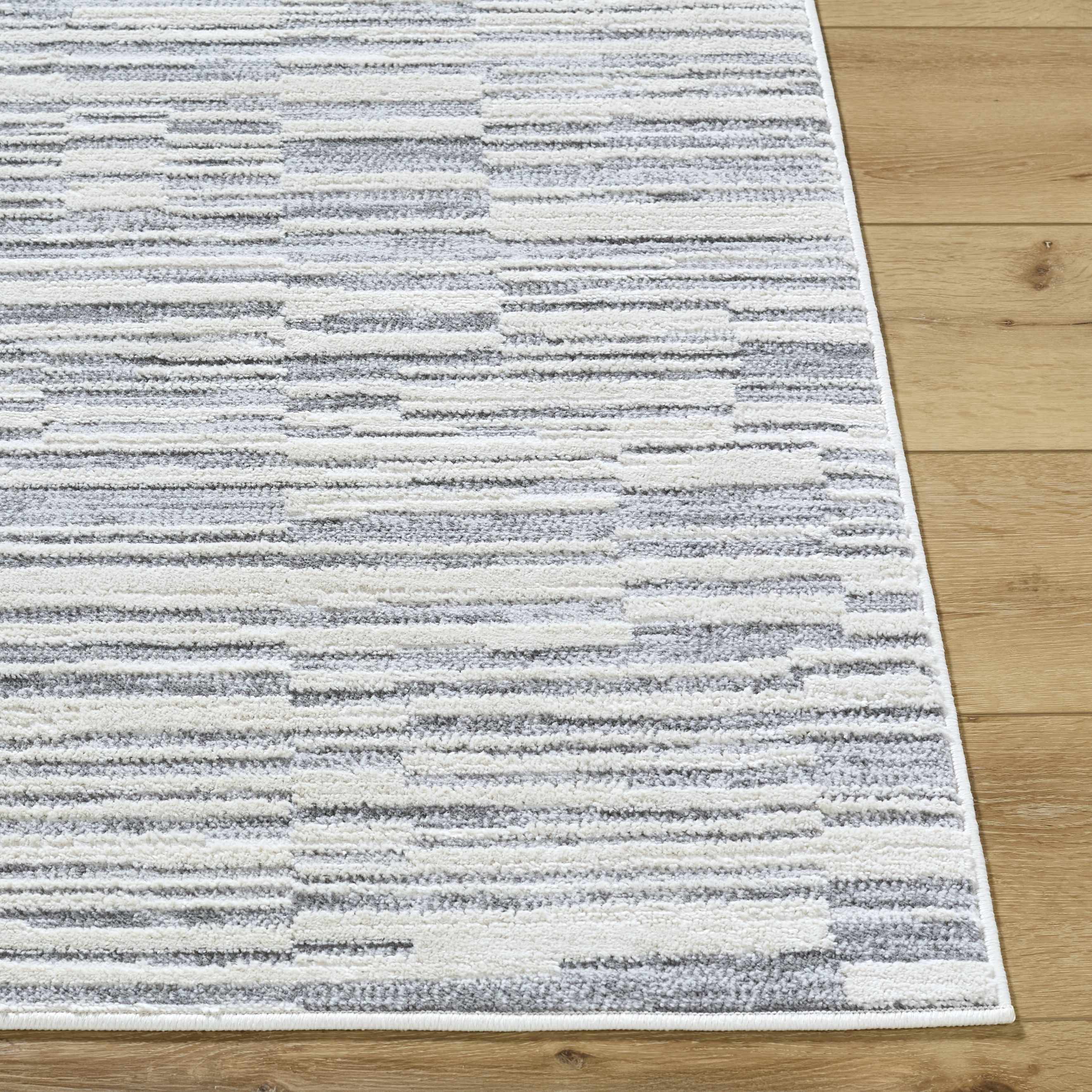 Straight-on shot of Alexey Gray Broken-Striped Area Rug, providing a full look at the design. Contemporary Area Rug Backing  