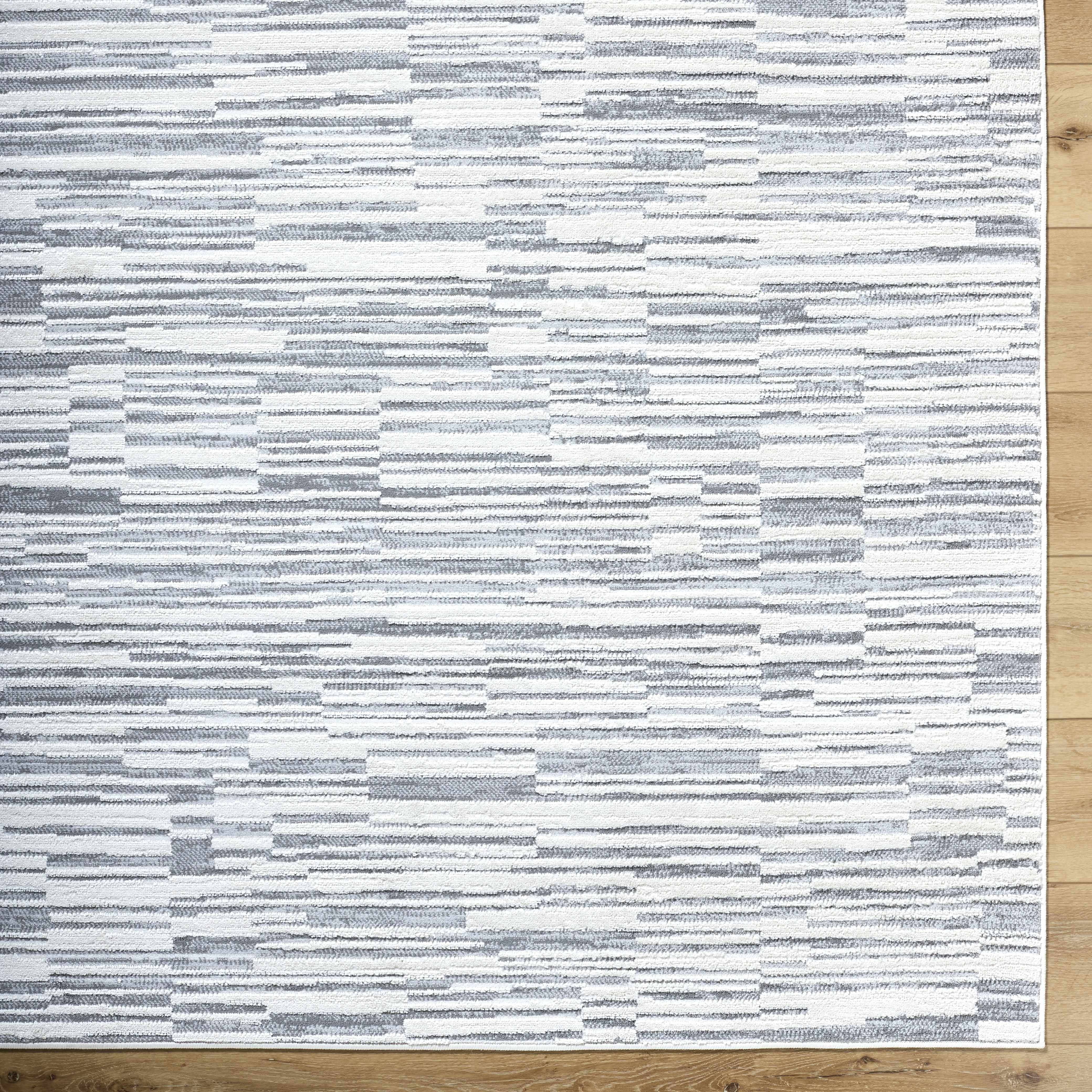 Reverse side of Alexey Gray Broken-Striped Area Rug, focusing on underside structure and material.Contemporary Area Rug Backing  