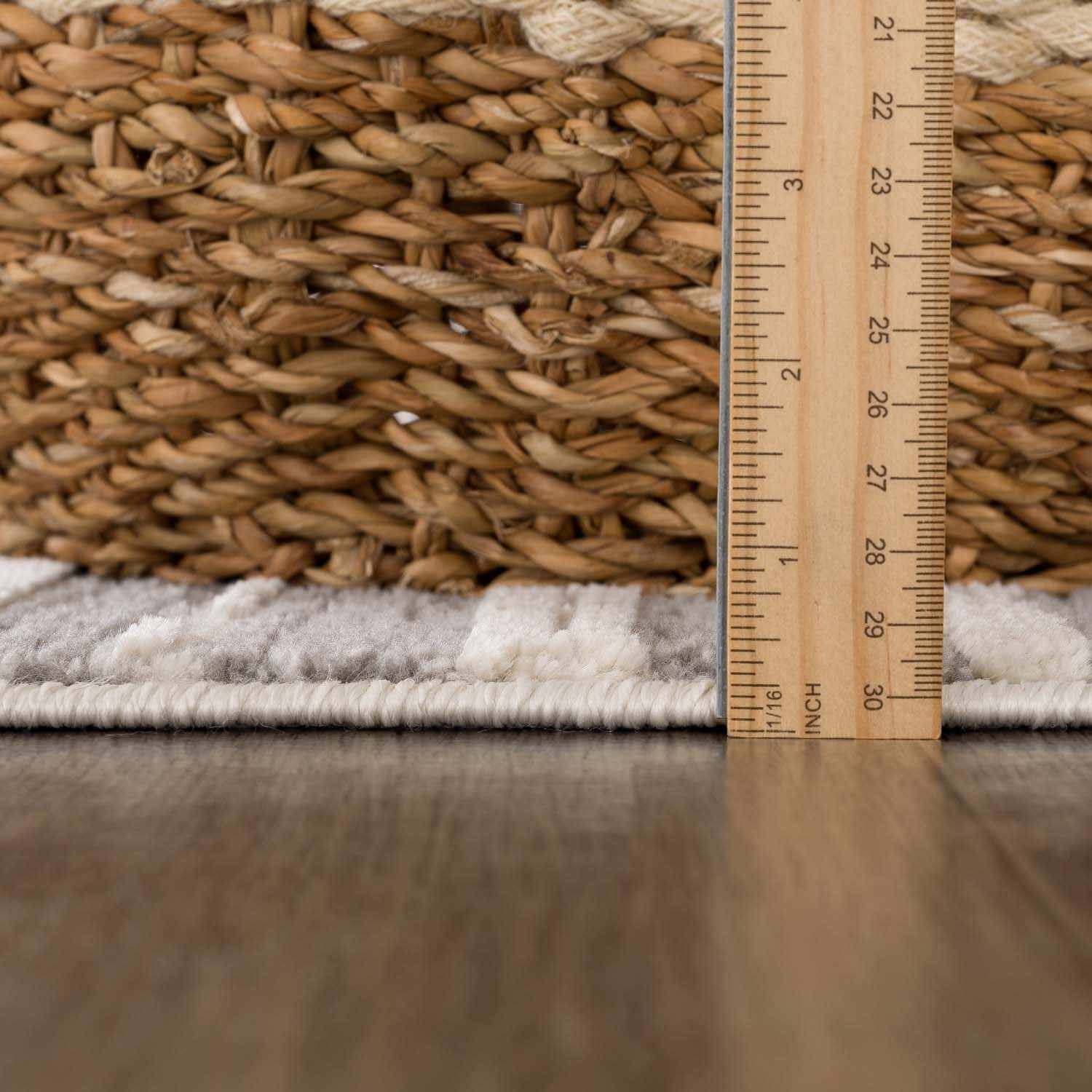 Detailed look at the pile on Alexey Gray Broken-Striped Area Rug, showcasing its softness and plushness. Contemporary Area Rug Backing  