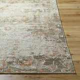 Close-up of the Limay Premium Wool Rug showing beige, olive, and coral floral pattern and hand-knotted texture. Front