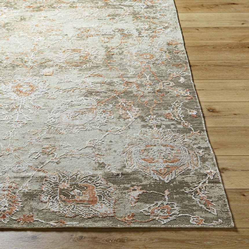 Close-up of the Limay Premium Wool Rug showing beige, olive, and coral floral pattern and hand-knotted texture. Front