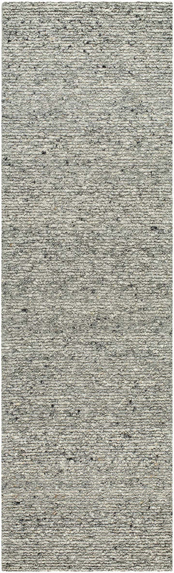 Close-up of the hand-tufted Winta Charcoal Wool Area Rug. The rug has a textured, looped pile with ash, gray, and silver gray tones. Design-Runner-310