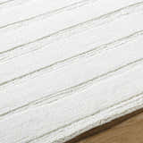 Close up of the Aurex Cream Stepped Arch Wool Rug showing its texture and stepped design. Texture