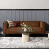 Living room scene with a Littleport Luxury Fringed Faux Silk Rug in gray tones under a brown leather sofa. Roomscene-Rectangle