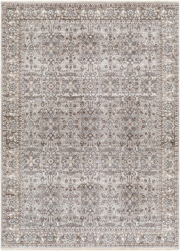 Detailed view of the Lugo Luxe Area Rug, a traditional rug with a charcoal and light gray floral pattern and tassel detail. Design-Rectangle-537