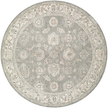 Close-up of the round Alinae Area Rug. Features a traditional floral pattern in cream, green, and light slate blue. Design-Round-53