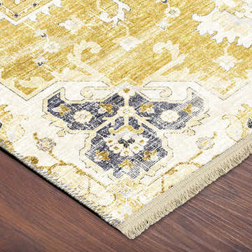 Close-up of the Dalyn Marbella MB3 Gold Washable Area Rug. Features chestnut, gold, and taupe traditional pattern.