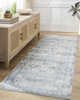 Hallway scene with a Mauro Blue Medallion Washable Area Rug runner, light wood floors, and a beige sideboard. Roomscene-Rectangle