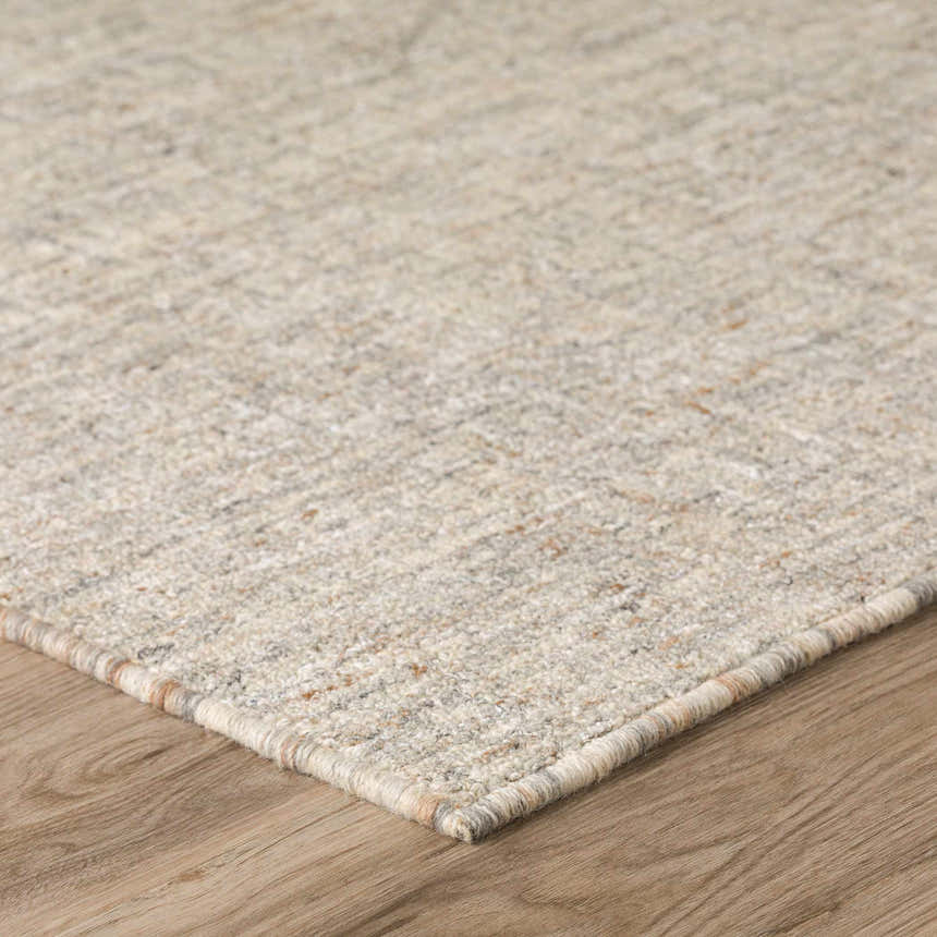 Close-up of the hand-tufted Dalyn Mateo ME1 Putty Area Rug showing beige, cream, and brown tones with a subtle pattern.