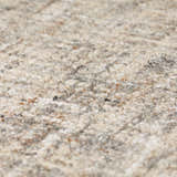Close-up of the textured Dalyn Mateo ME1 Putty Area Rug. Beige, cream, and brown wool and viscose fibers.