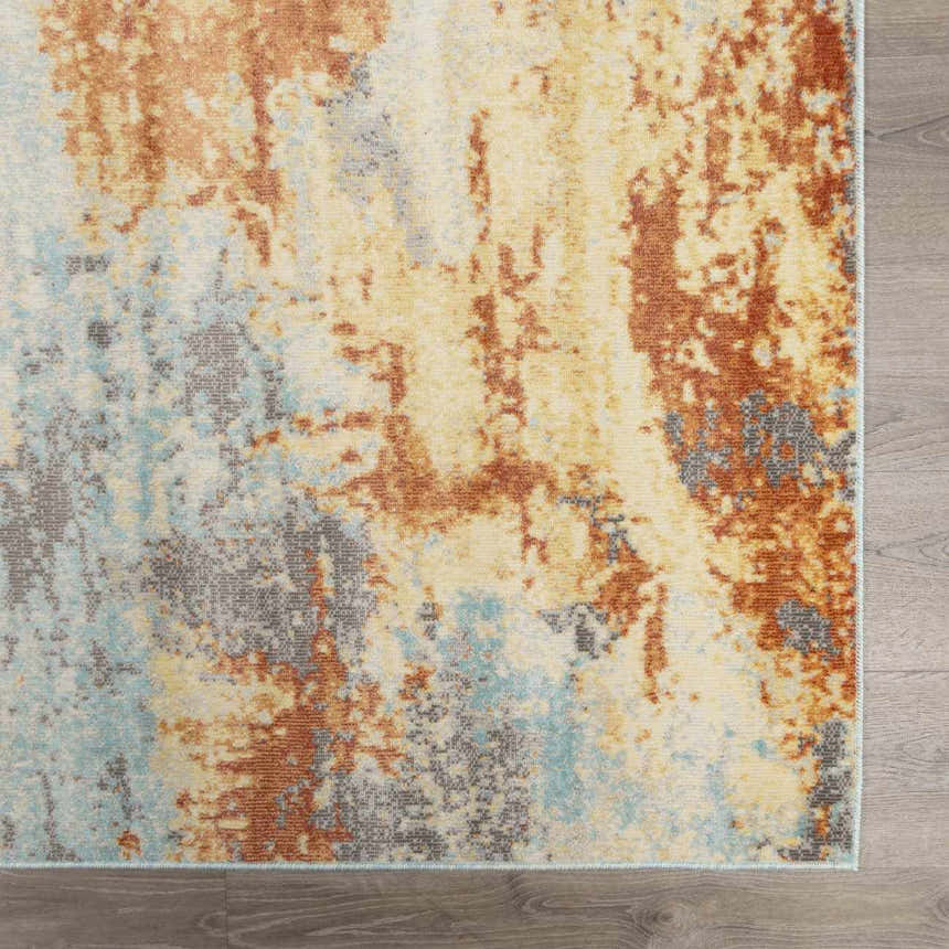 Close-up of Mecosta Light Outdoor Area Rug. Abstract brick red, charcoal, ivory, and pale blue design. Swatch