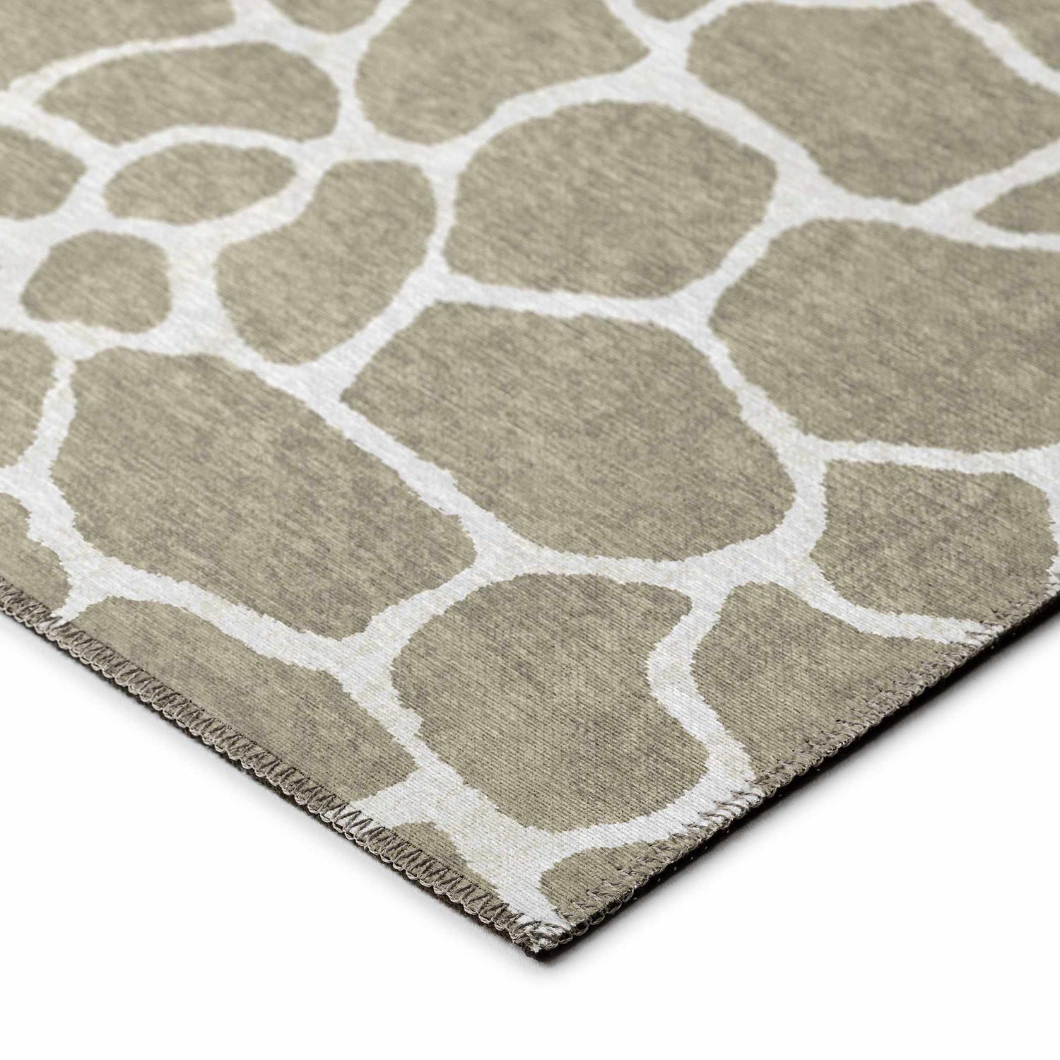 Close-up of Dalyn Mali ML4 Stone Washable Area Rug. Chestnut and ivory organic shapes pattern. Non-skid polyester rug.