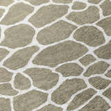 Close-up of Dalyn Machine Indoor/Outdoor Mali ML4 Stone Washable Area Rug with a chestnut and ivory organic pattern.