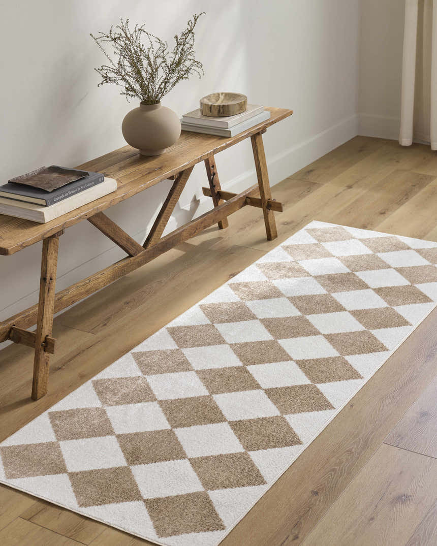 Entryway with wood bench and Ulric Brown Diamond Washable Area Rug in a brown and cream geometric pattern. Roomscene-Runner