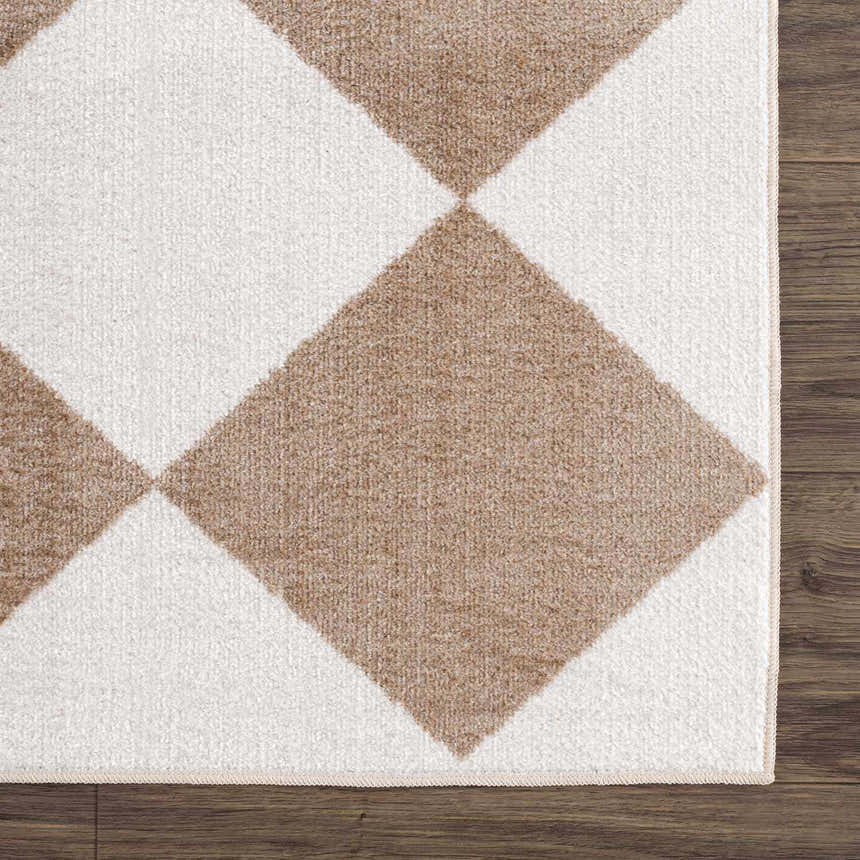 Close-up of the Ulric Brown Diamond Washable Area Rug showing its geometric diamond pattern and soft texture. Brown and off-white colors. Swatch