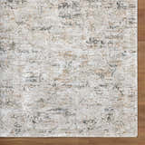 Close-up of the Meral Thick Luxe Boutique Rug. Charcoal, cream, brown, and gray Southwestern pattern. Luxe texture. Corner