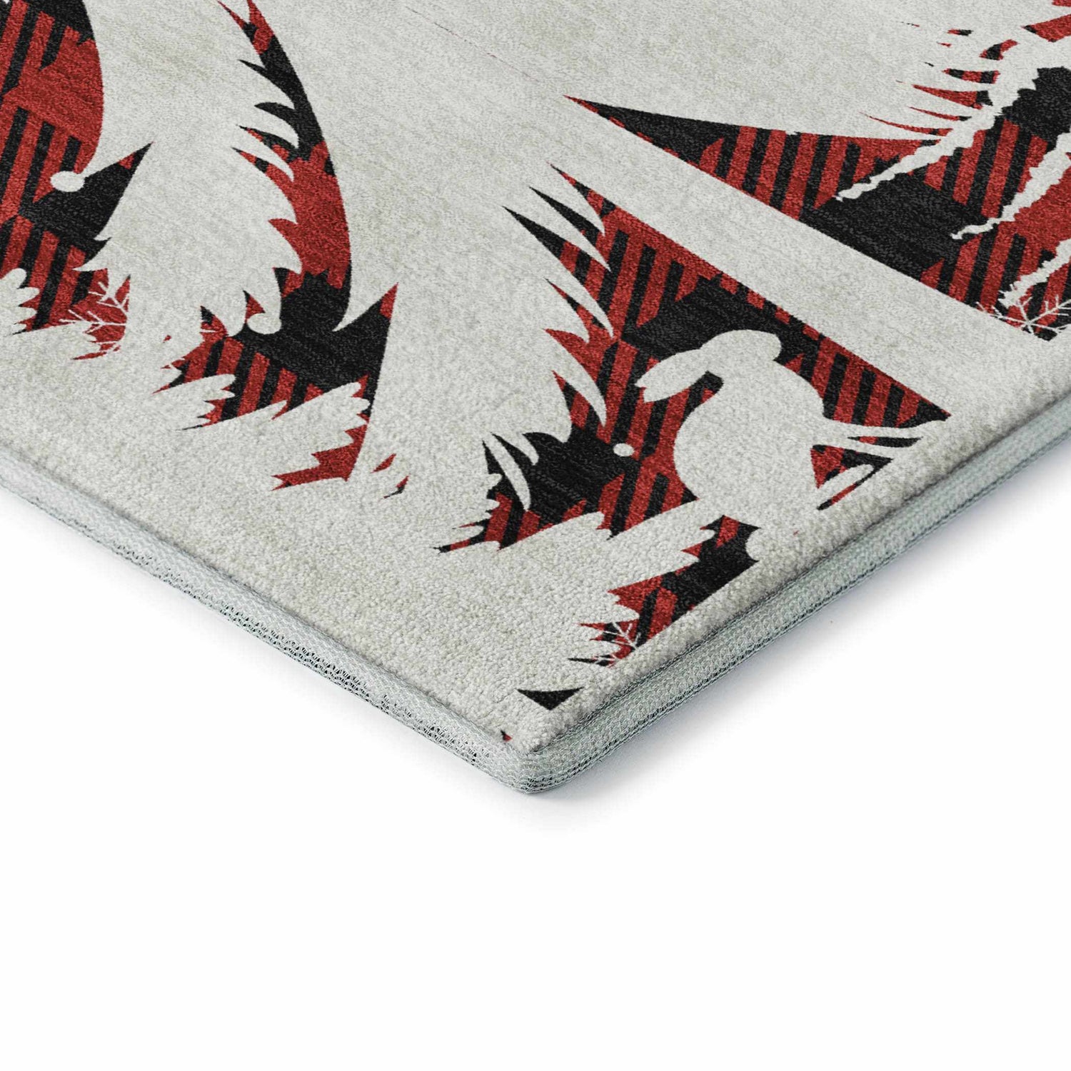 Close-up of Dalyn Luxury Merry & Bright rug. Red and black plaid trees on a light background. Holiday style.