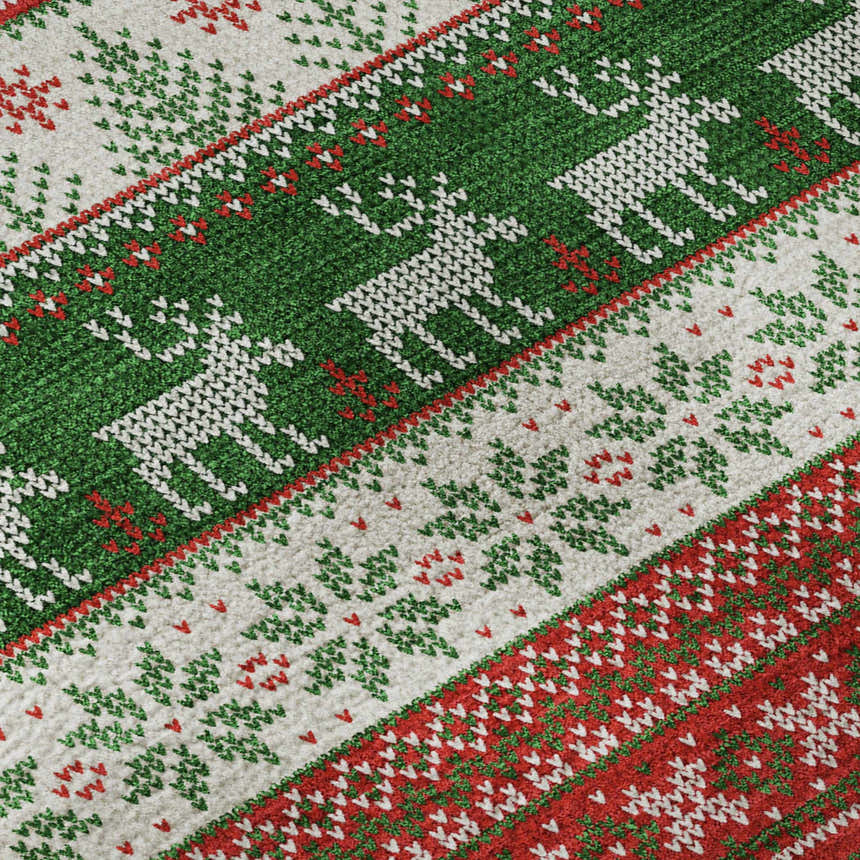 Close up of the Dalyn Luxury Merry & Bright rug. Red, green, and white holiday pattern with reindeer and trees.