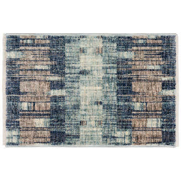 Close-up of the Dalyn Neola NA11 navy area rug. Features a farmhouse-style pattern with chestnut, light blue, and taupe hues.