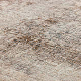 Close-up of the Dalyn Neola NA8 Taupe Area Rug showing beige, brown, and black fibers. Transitional style rug texture.