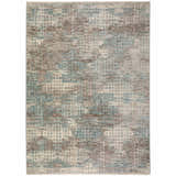 Close-up of the Dalyn Neola NA9 Denim Area Rug. Features chestnut, denim, ivory, and taupe hues in a geometric pattern.