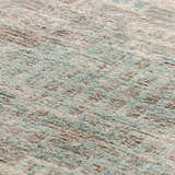 Close-up of the Dalyn Neola NA9 Denim Area Rug showing its texture and colors: denim, chestnut, taupe, ivory, and light blue.