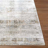 Close-up of Neron Blue Gray Thick Luxe Abstract Rug showing charcoal, cream, and light brown tones on wood flooring. Front